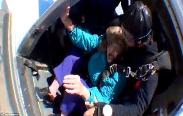 80-year old Laverne is forced from the plane by her instructor. Source: TheChive.com