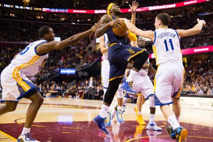 Harrison Barnes and Klay Thompson try to stop LeBron James, which is hard. (Jason Miller/Getty Images)