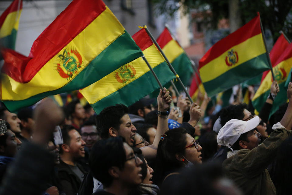 Anti-government protesters march against early presidential election results in La Paz, Bolivia, Tuesday, Oct. 22, 2019. International election monitors expressed concern over Bolivia's presidential election process Tuesday after an oddly delayed official quick count showed President Evo Morales near an outright first-round victory — even as a more formal tally tended to show him heading for a risky runoff. (AP Photo/Jorge Saenz)