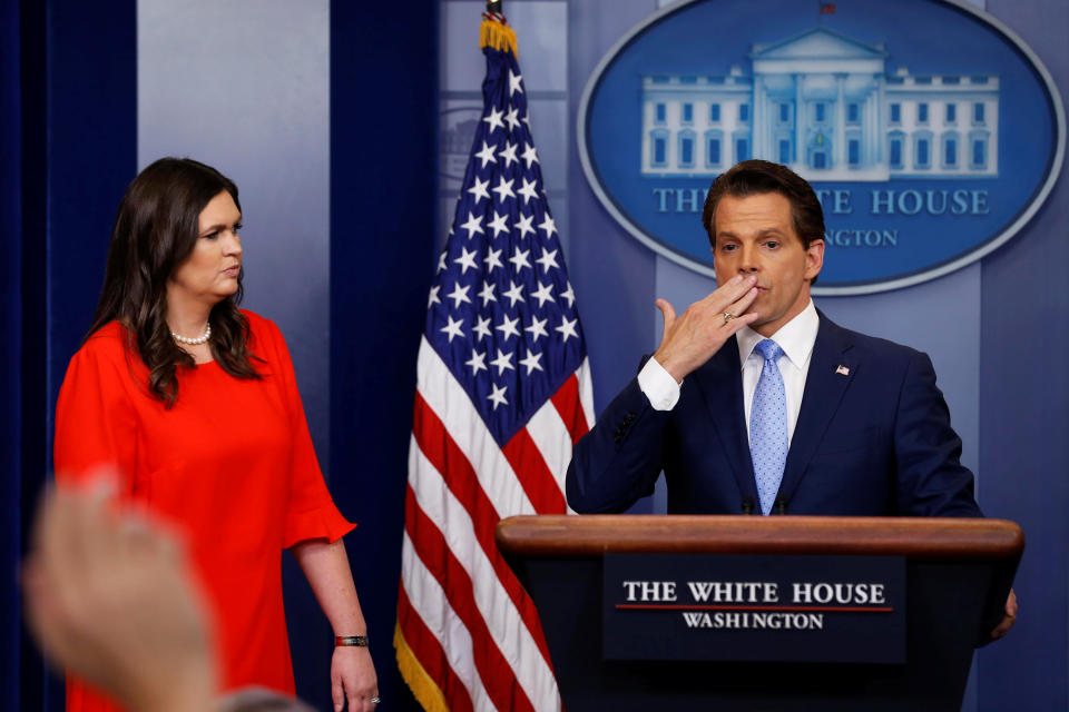 White House Communications Director Anthony Scaramucci, flanked by White House Press Secretary Sarah Sanders, blows a kiss to reporters after addressing the daily briefing at the White House, July 21, 2017. (Jonathan Ernst/Reuters)