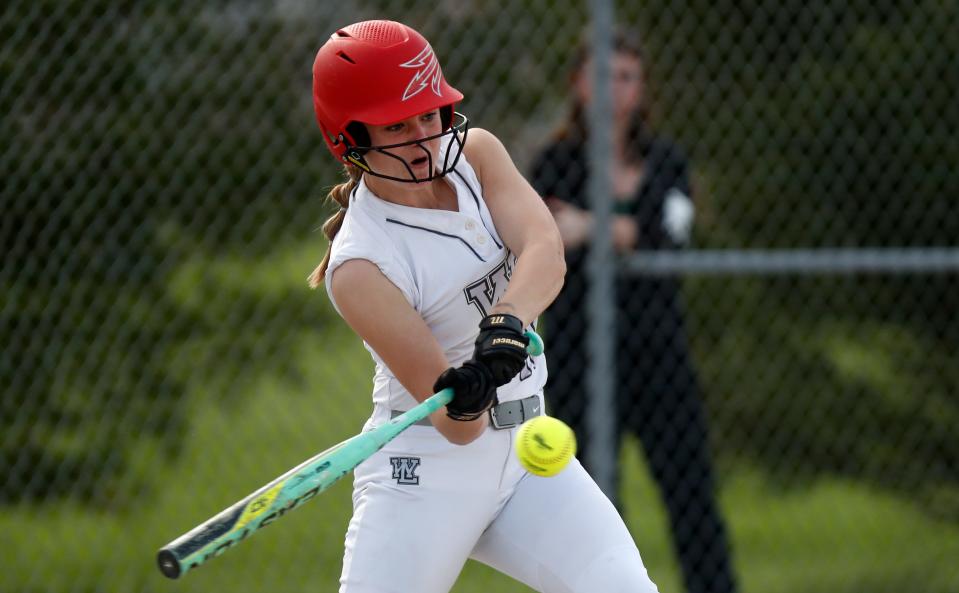 West Lafayette Red Devils first baseman Bree Johnson (10) hits the ball during the IHSAA softball game against the Harrison Raiders, Monday, May 8, 2023, at West Lafayette High School in West Lafayette, Ind. Harrison won 14-1.