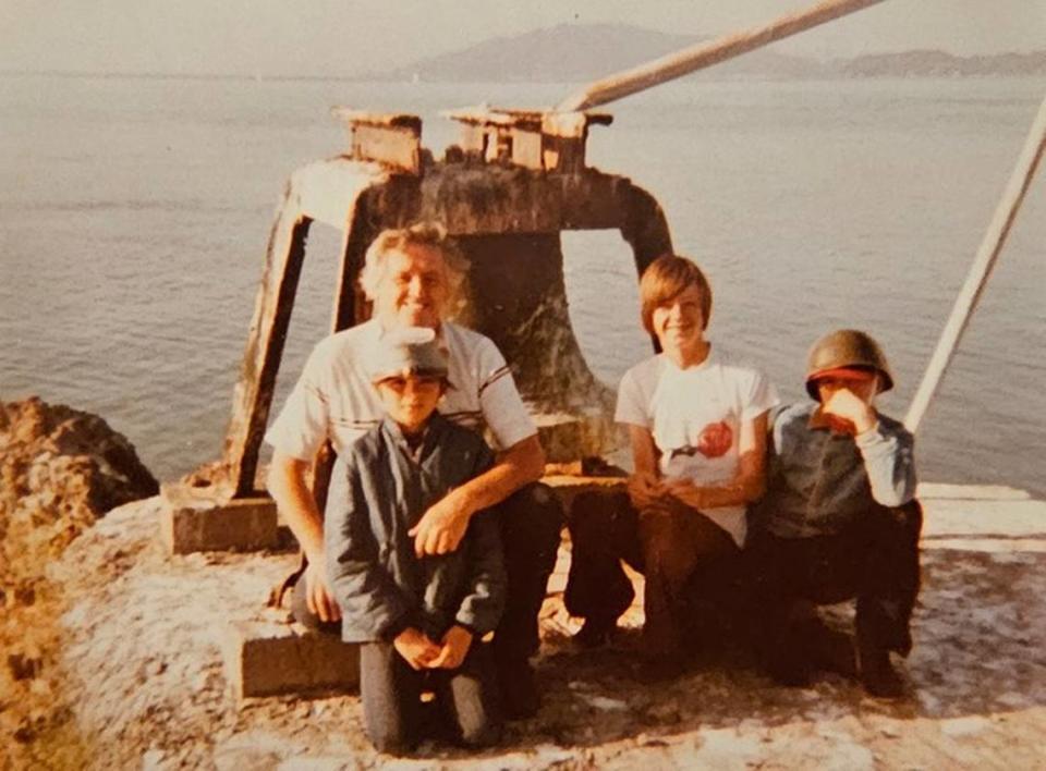 Seller Brock Durning kneels in front of his father, Mack Durning, with brothers Brian and Brent, on a 1979 family visit to the Red Rock Island in the San Francisco Bay.