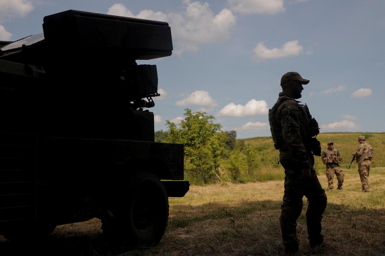 File photo: Ukrainian servicemen stand next to an AN/TWQ-1 Avenger mobile air defence missile system (REUTERS)