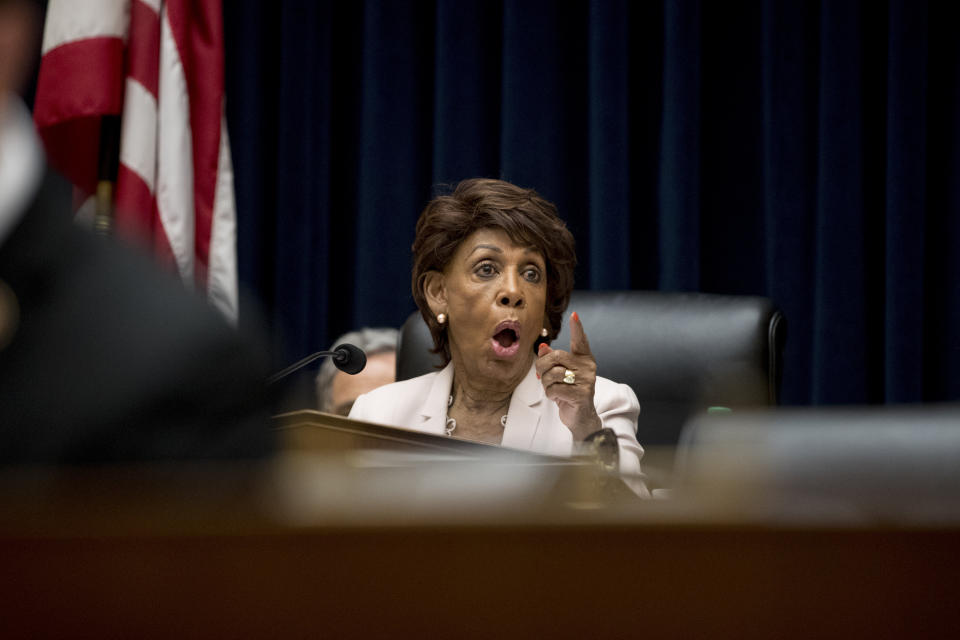 Chairwoman Rep. Maxine Waters, D-Calif. speaks to a colleague as David Marcus, CEO of Facebook's Calibra digital wallet service, testifies before a House Financial Services Committee hearing on Facebook's proposed cryptocurrency on Capitol Hill in Washington, Wednesday, July 17, 2019. (AP Photo/Andrew Harnik)