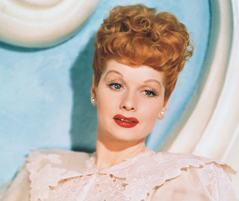 Lucille Ball wearing a lacy dress