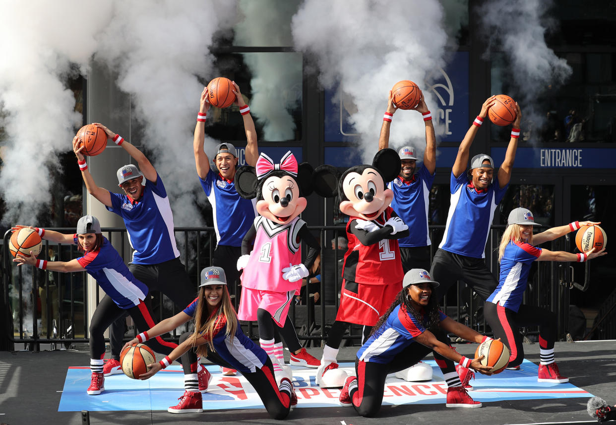 Mickey Mouse and Minnie with dancers during the opening day for NBA Experience, a basketball-driven interactive attraction at Disney Springs in Orlando, Fla., on August 12, 2019. (Ricardo Ramirez Buxeda/Orlando Sentinel/Tribune News Service via Getty Images)