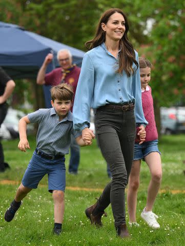 DANIEL LEAL/POOL/AFP via Getty Images Prince Louis, Kate Middleton and Princess Charlotte at the Big Help Out on May 8, 2023