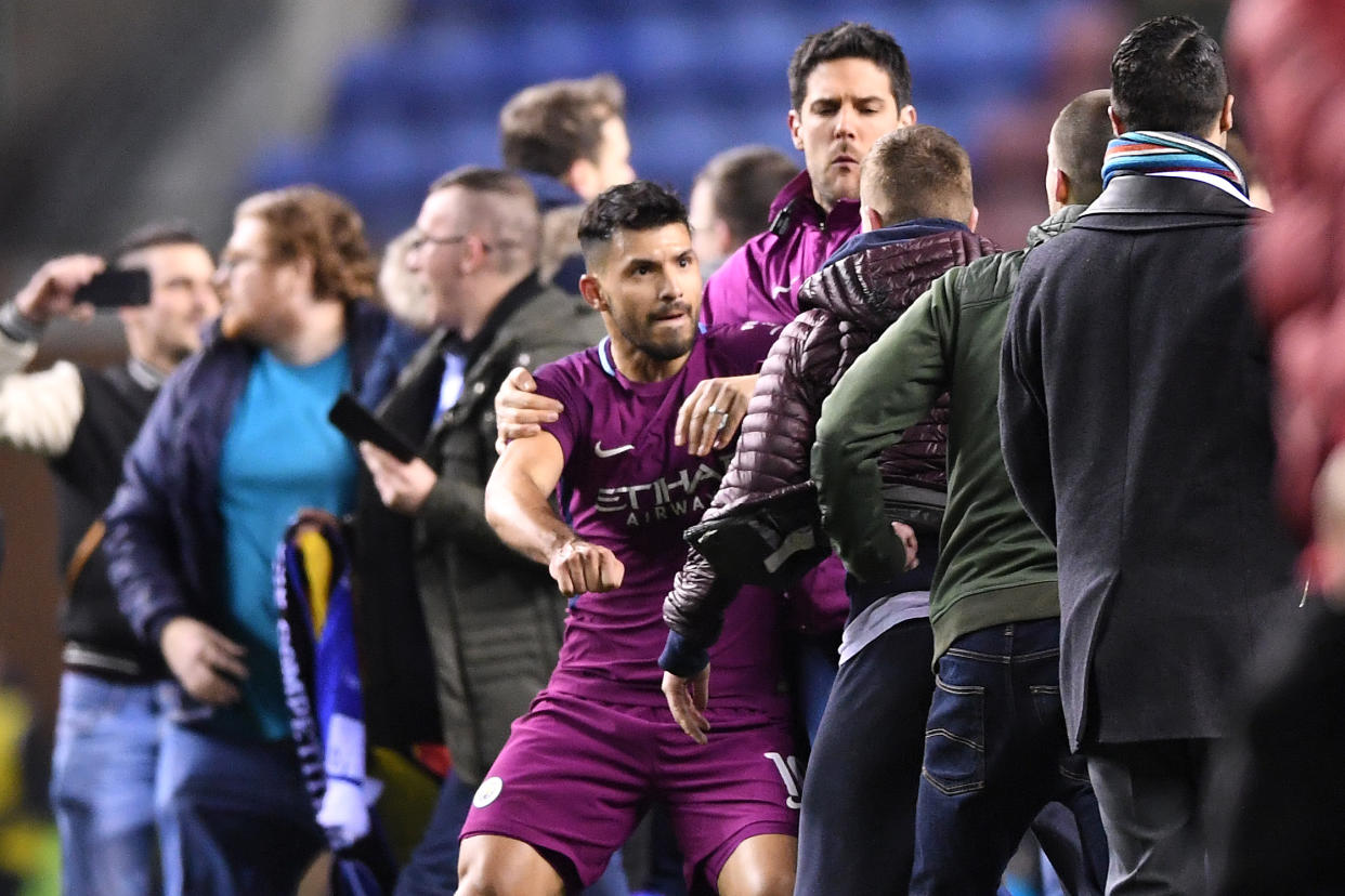 Sergio Aguero was surrounded by Wigan fans as he attempted to leave the pitch after Manchester City FA Cup loss. (Getty)