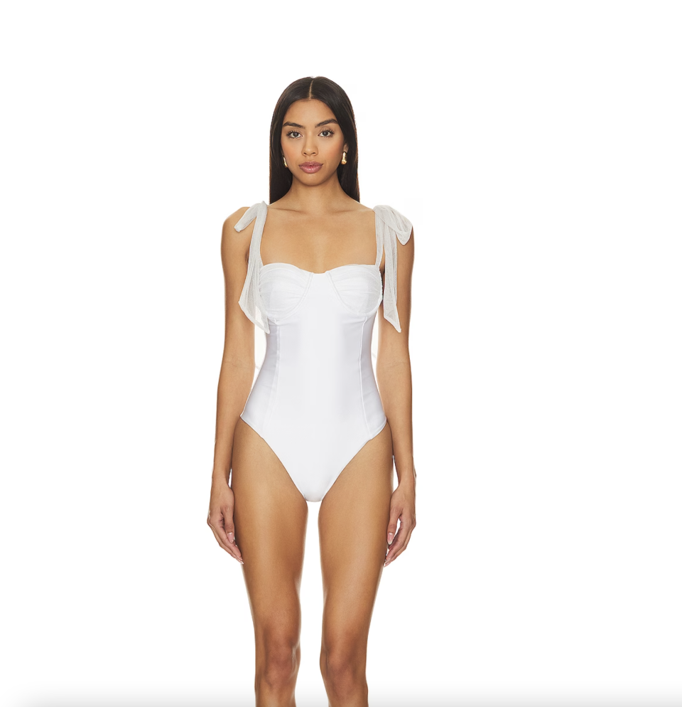 <p><a href="https://go.redirectingat.com?id=74968X1596630&url=https%3A%2F%2Fwww.revolve.com%2Fbeach-riot-dede-one-piece-in-white%2Fdp%2FBRIO-WX1303%2F%3Fd%3DF%26currency%3DUSD%26countrycode%3DUS%26gad_source%3D1%26gclid%3DEAIaIQobChMI95zM55DbhAMVay7UAR0YpgZnEAQYASABEgIzCfD_BwE%26gclsrc%3Daw.ds&sref=https%3A%2F%2Fwww.cosmopolitan.com%2Fstyle-beauty%2Ffashion%2Fg60078657%2Fbest-bridal-swimsuits%2F" rel="nofollow noopener" target="_blank" data-ylk="slk:Shop Now;elm:context_link;itc:0;sec:content-canvas" class="link ">Shop Now</a></p><p>Dede One Piece</p><p>$168.00</p>