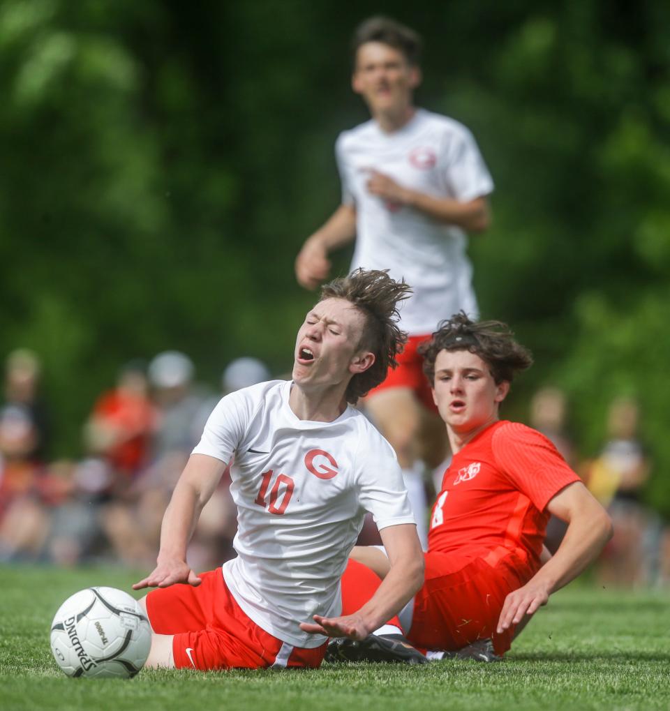 Gilbert's Truman Kruckenberg (10) and Marion's Grayson Kirsch (8) collide during the Class 2A Boys State Soccer Tournament quarterfinal at the Cownie Soccer Complex Wednesday, June 1, 2022 in Des Moines.