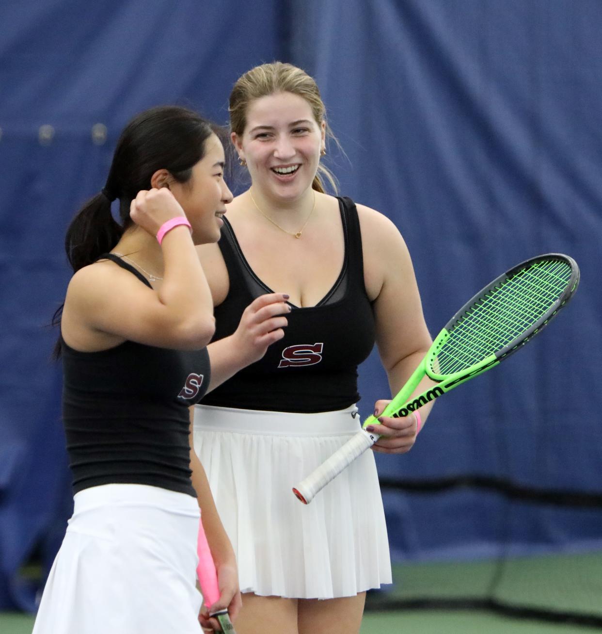 Emma Ha, left, and Kay Cottrell of Scarsdale celebrate their win against Williamsville East in the Division 2 NYSPHSAA team state semifinals at USTA Billie Jean King National Tennis Center Nov. 3, 2023.