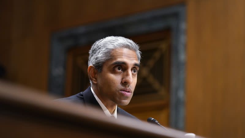 Surgeon General Dr. Vivek Murthy testifies before the Senate Finance Committee on Capitol Hill in Washington, Tuesday, Feb. 8, 2022. Murphy is urging swift action to combat loneliness in the nation.