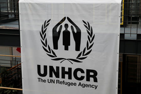 A logo is pictured on a banner at the UNHCR headquarters in Geneva, Switzerland June 13, 2018. REUTERS/Denis Balibouse