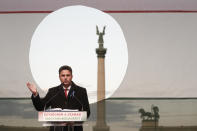 Hungarian opposition candidate Peter Marki-Zay addresses supporters during celebration the 65th anniversary of the 1956 Hungarian revolution, in Budapest, Hungary, Saturday, Oct. 23, 2021. Earlier thousands of supporters of Prime Minister Viktor Orban, who delivered a speech marking the 65th anniversary of the 1956 Hungarian revolution, marched to demonstrate loyalty to his right-wing government. (AP Photo/Laszlo Balogh)