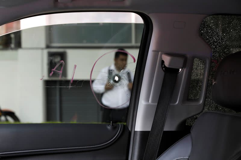 A bullet impact is pictured at the window of a truck following an attack by unknown assailants in Mexico City