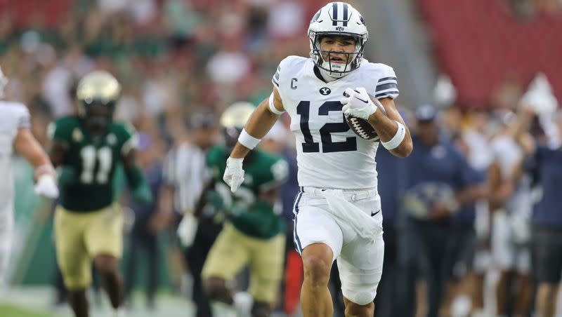 BYU wide receiver Puka Nacua scores on the first play from scrimmage in BYU’s opener against USF, Saturday, September 3 at Raymond James Stadium in Tampa. The talented receiver is hoping to hear his named called this weekend at the NFL draft.