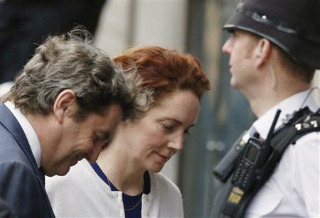 Former News International chief executive Rebekah Brooks and her husband Charlie Brooks (L) arrive at the Old Bailey courthouse in London February 20, 2014. REUTERS/Luke MacGregor