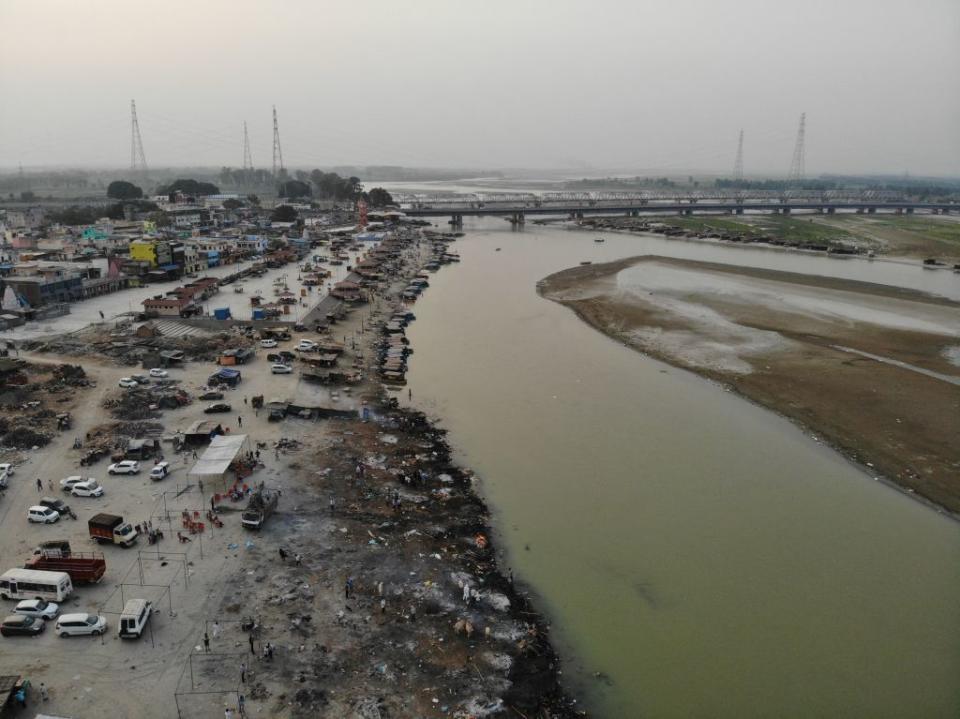 In this aerial photograph  funeral pyres of Covid-19 coronavirus victims are seen in a cremation ground along the banks of the Ganges River, in Garhmukteshwar.