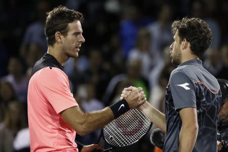 Mar 23, 2018; Key Biscayne, FL, USA; Juan Martin del Potro of Argentina (L) shakes hands with Robin Haase of the Netherlands (R) on day four of the Miami Open at Tennis Center at Crandon Park. Mandatory Credit: Geoff Burke-USA TODAY Sports