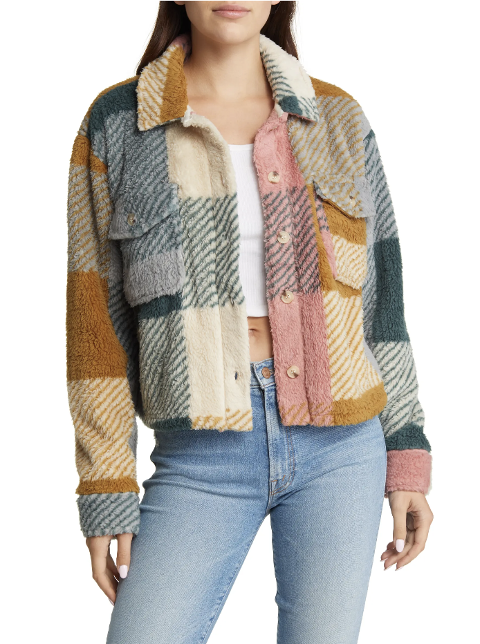brunette model wearing blue jeans and pink, yellow, green jacket, Thread & Supply Crop Fleece Shirt Jacket in multi check plaid (Photo via Nordstrom)