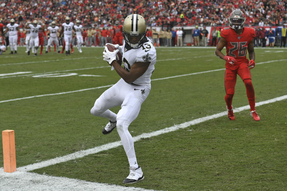 New Orleans Saints wide receiver Michael Thomas (13) beats Tampa Bay Buccaneers defensive back Sean Murphy-Bunting (26) on a 16-yard touchdown reception during the first half of an NFL football game Sunday, Nov. 17, 2019, in Tampa, Fla. (AP Photo/Jason Behnken)