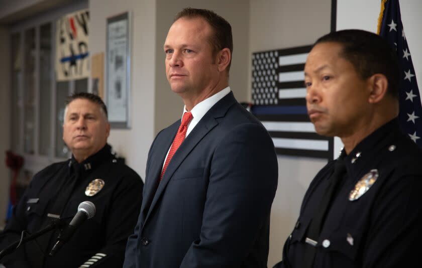 RESEDA, CA - DECEMBER 05: Left to right: Los Angeles Police Capt. Brian Wendling, Detective Joseph Hampton and Deputy Chief Alan Hamilton hold a press conference at the West Valley Division to ask for the public's help about a sexual assault that happened on a hiking trail near Mulholland Drive on November 21. Photographed on Monday, Dec. 5, 2022. (Myung J. Chun / Los Angeles Times)