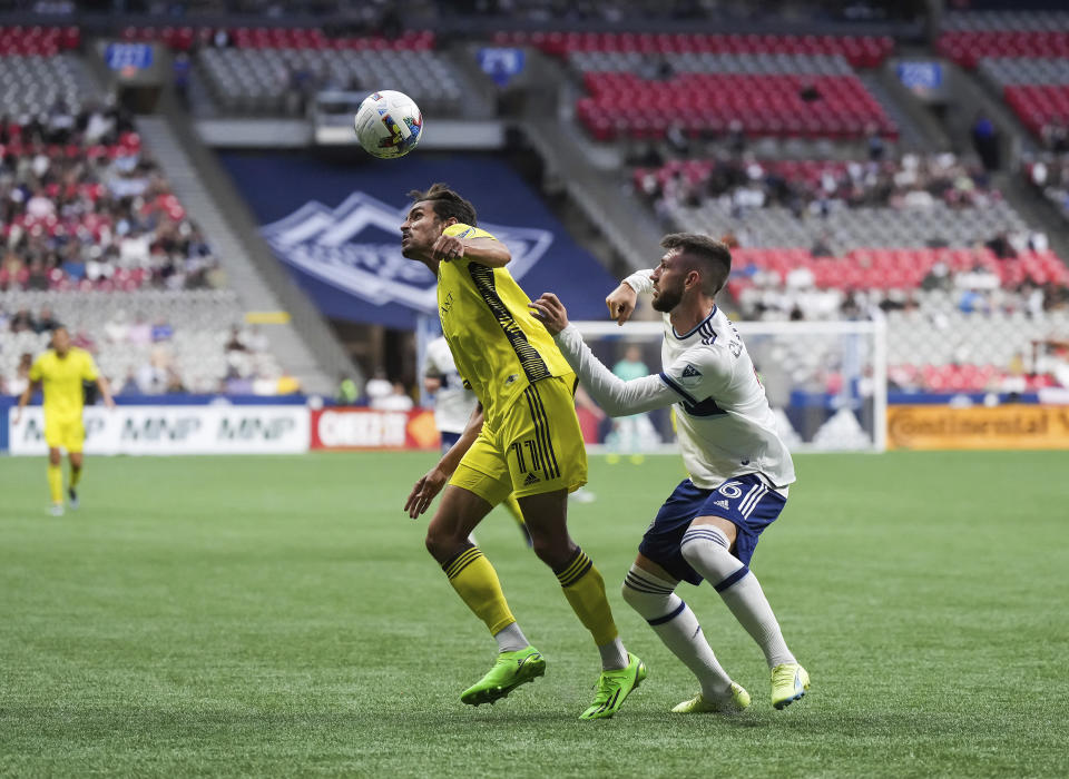 Nashville FC's Ethan Zubak (11) and Vancouver Whitecaps' Tristan Blackmon (6) vie for the ball during first-half MLS soccer match action in Vancouver, British Columbia, Saturday, Aug. 27, 2022. (Darryl Dyck/The Canadian Press via AP)