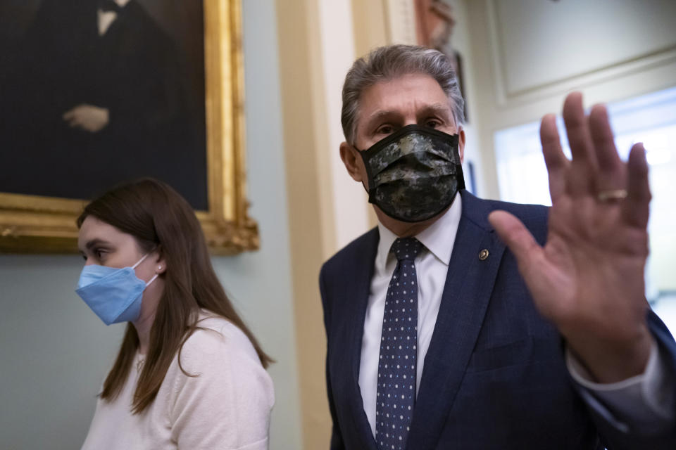 Sen. Joe Manchin, D-W.Va., walks past reporters after attending a lengthy Democratic Caucus meeting as the Senate continues to grapple with end-of-year tasks at the Capitol in Washington, Thursday, Dec. 16, 2021. Manchin’s reluctance to endorse the Biden administration’s expanded child tax credit program is rippling through his home state of West Virginia. Manchin, a moderate Democrat, is one of the last holdouts delaying passage of President Joe Biden’s massive social and environmental package. (AP Photo/J. Scott Applewhite)