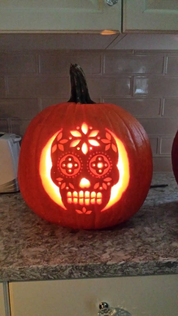 a skeleton carved into a pumpkin