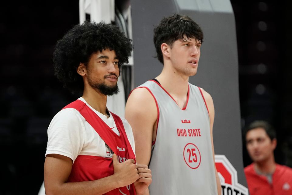 Oct 19, 2023; Columbus, Ohio, USA; Ohio State Buckeyes guard Taison Chatman (3) and center Austin Parks (25) watch from under the basket during an open practice at Value City Arena.