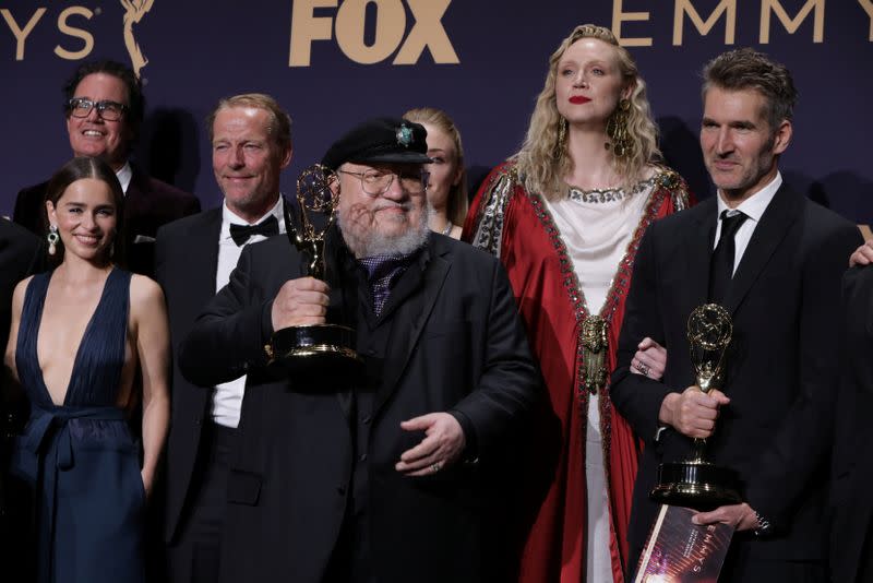 FILE PHOTO: 71st Primetime Emmy Awards - Photo Room – Los Angeles, California, U.S., September 22, 2019 -George R.R. Martin (C) and the cast and crew of Game of Thrones poses backstage with their award for Outstanding Drama Series