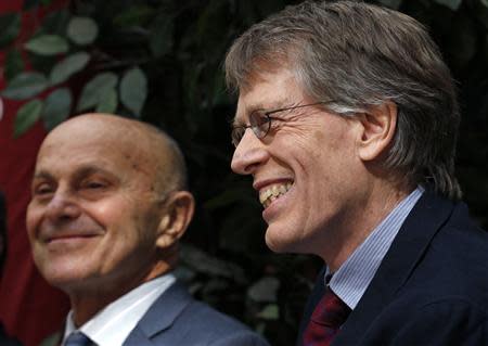 University of Chicago professors Eugene F. Fama (L) and Lars Hansen share a laugh at the end of a news conference after it was announced they won the 2013 Nobel Prize in Economics in Chicago, October 14, 2013. REUTERS/Jim Young