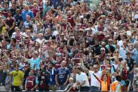 West Ham fans cheer as bubbles fill the air before the kick off of the pre-season friendly football match