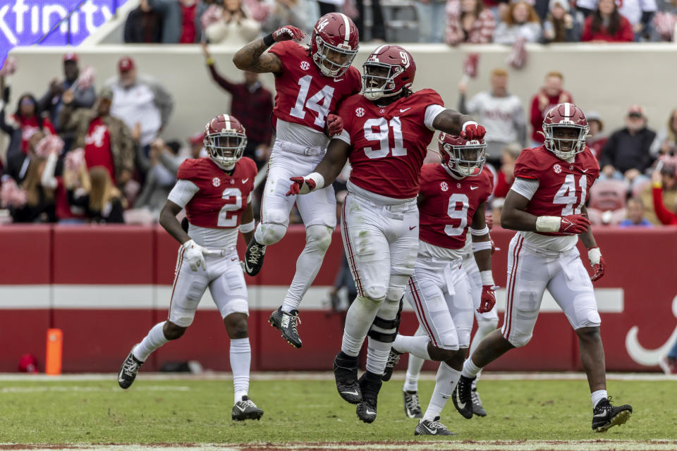 Alabama defensive back Brian Branch (14) celebrates his interception with defensive lineman Jaheim Oatis (91) during the second half of an NCAA college football game against Austin Peay, Saturday, Nov. 19, 2022, in Tuscaloosa, Ala. (AP Photo/Vasha Hunt)