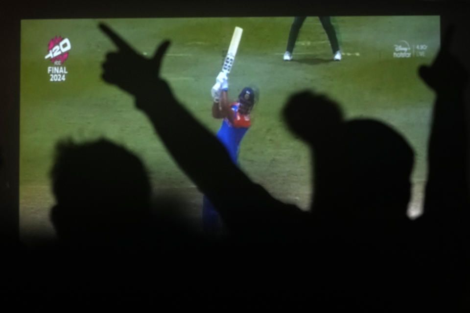 Cricket fans cheer as they watch the live coverage of the ICC Men's T20 World Cup final match between India and South Africa being played at Bridgetown, Barbados in Mumbai, India, Saturday, June 29, 2024. (AP Photo/Rajanish Kakade)