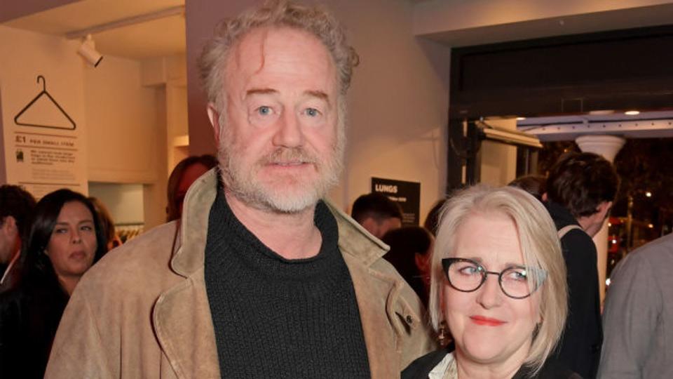 Owen Teale and wife Sylvestra pose together for a photo at a press night 