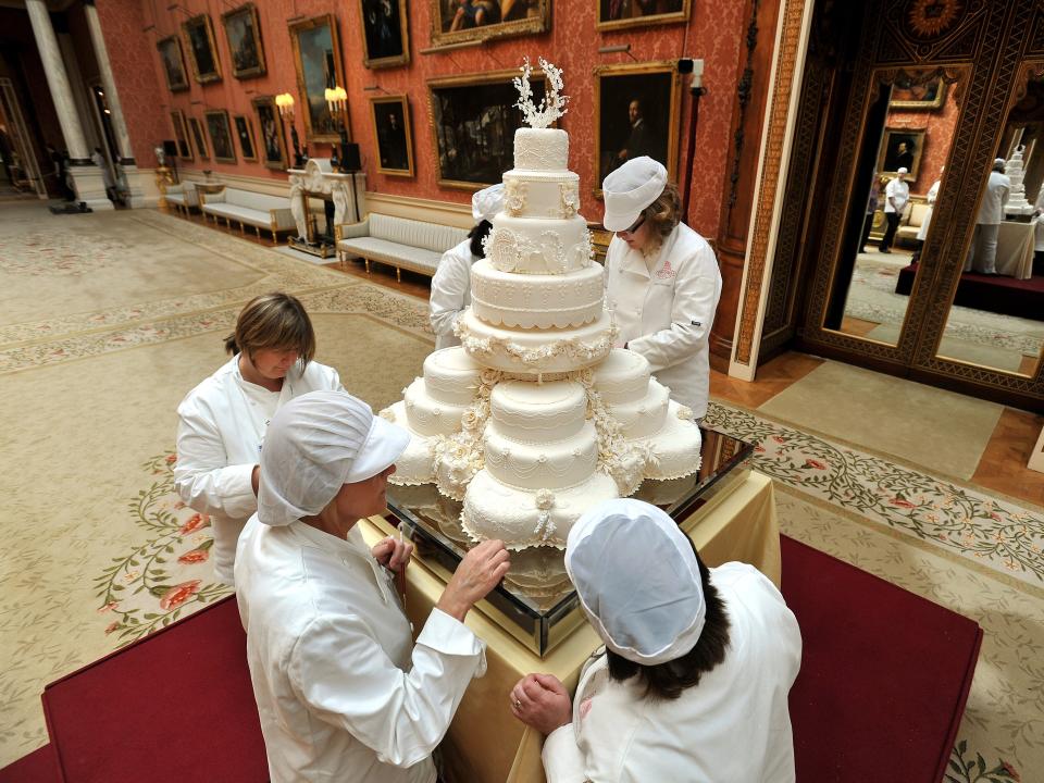 Pastry chefs work on Kate Middleton and Prince William's eight-tier wedding cake.