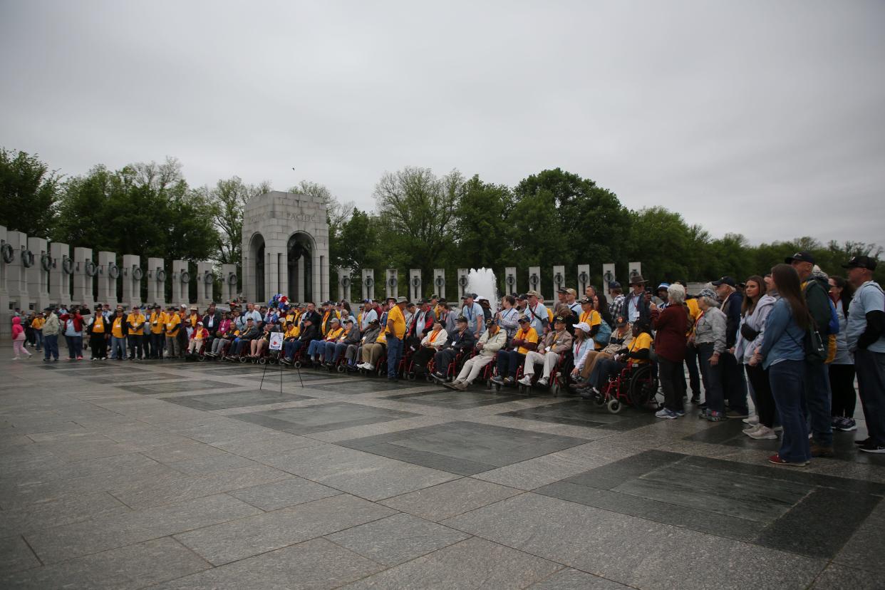 All Honor Flight Tallahassee attendees line up for a group picture at the World War II Memorial , April 27, 2024.