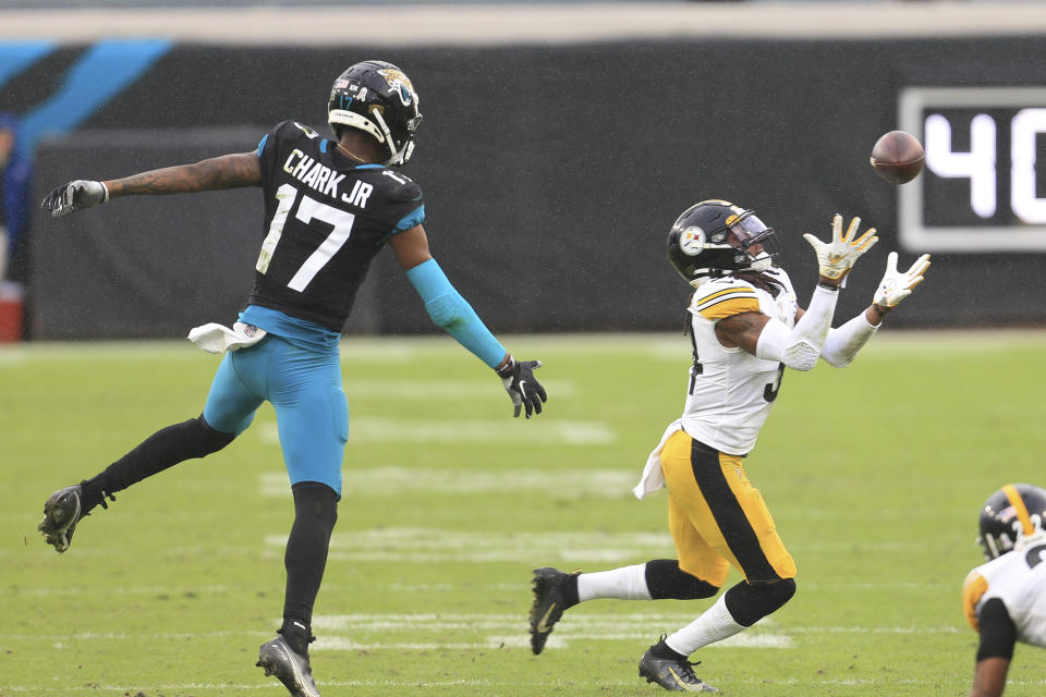 Pittsburgh Steelers safety Terrell Edmunds, right, intercepts a pass intended for Jacksonville Jaguars wide receiver DJ Chark Jr. (17) during the second half of an NFL football game, Sunday, Nov. 22, 2020, in Jacksonville, Fla. (AP Photo/Matt Stamey)