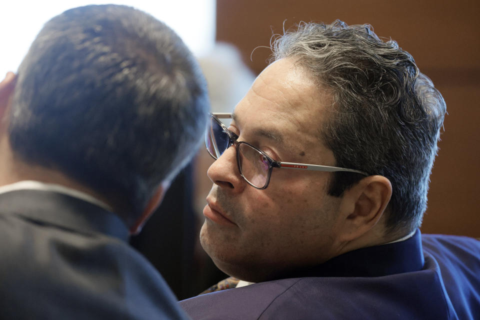 David Brill, who represents the Pollack, Hoyer, Petty and Schachter families, speaks with a colleague during a hearing regarding the Marjory Stoneman Douglas High School civil case at the Broward County Courthouse in Fort Lauderdale, Fla., Monday, Dec. 18, 2023. All four families lost children in the 2018 shootings at Marjory Stoneman Douglas High School. (Amy Beth Bennett/South Florida Sun-Sentinel via AP, Pool)