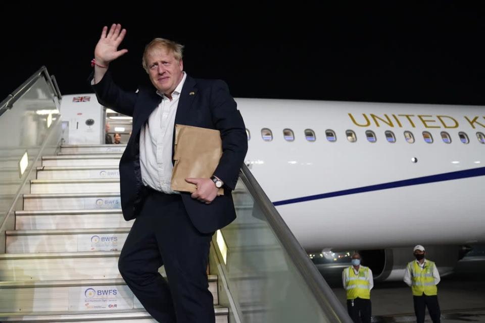 Prime Minister Boris Johnson waves as his boards his plane for the UK at Delhi airport at the end of his two-day trip to India (Stefan Rousseau/PA) (PA Wire)