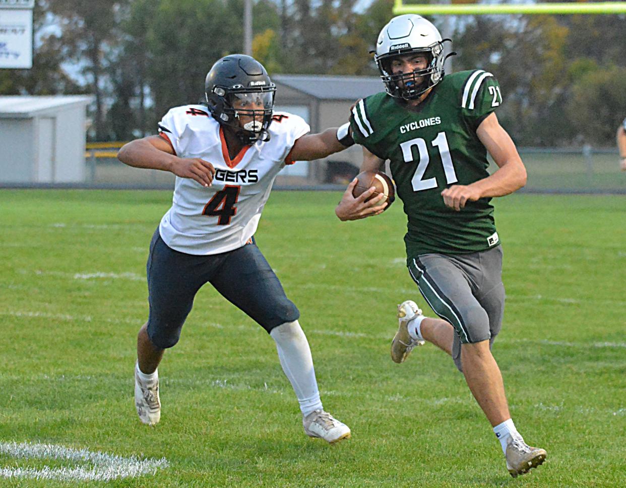 Clark-Willow Lake quarterback Emmerson Larson scrambles for yardage against Mobridge-Pollock's Mack Saxon during their high school football game on Friday, Sept. 22, 2023 in Clark.