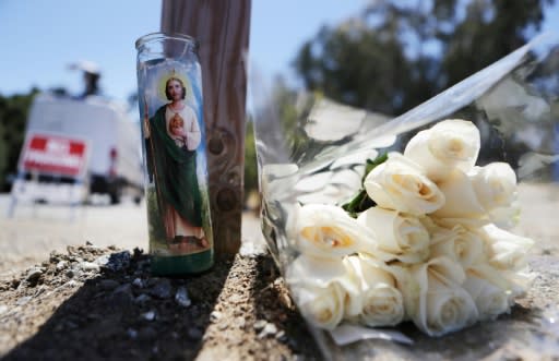 GILROY, CALIFORNIA - JULY 29: Flowers and a candle sit outside the site of the Gilroy Garlic Festival after a mass shooting there yesterday on July 29, 2019 in Gilroy, California. led the suspect. Mario Tama/Getty Images/AFP