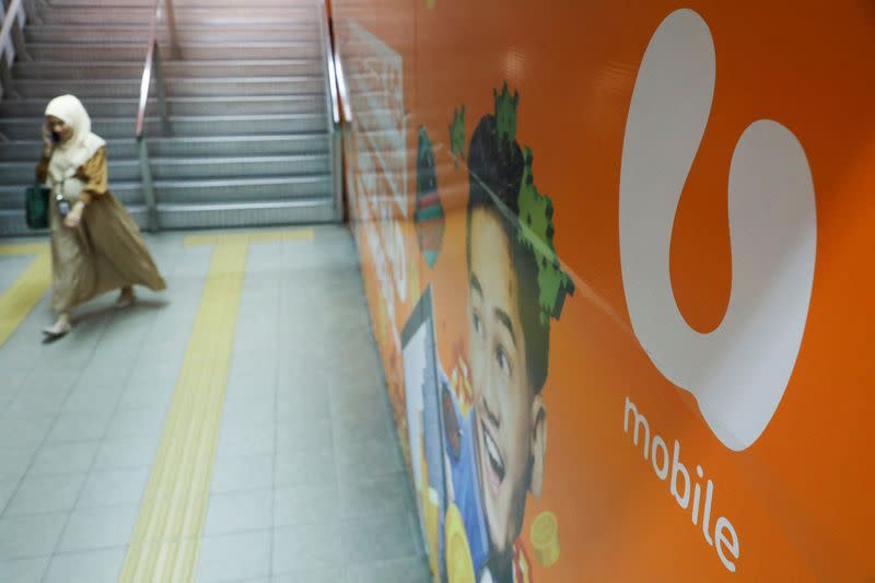 Logo of U Mobile, Malaysian mobile carrier, is displayed at a monorail station in Kuala Lumpur