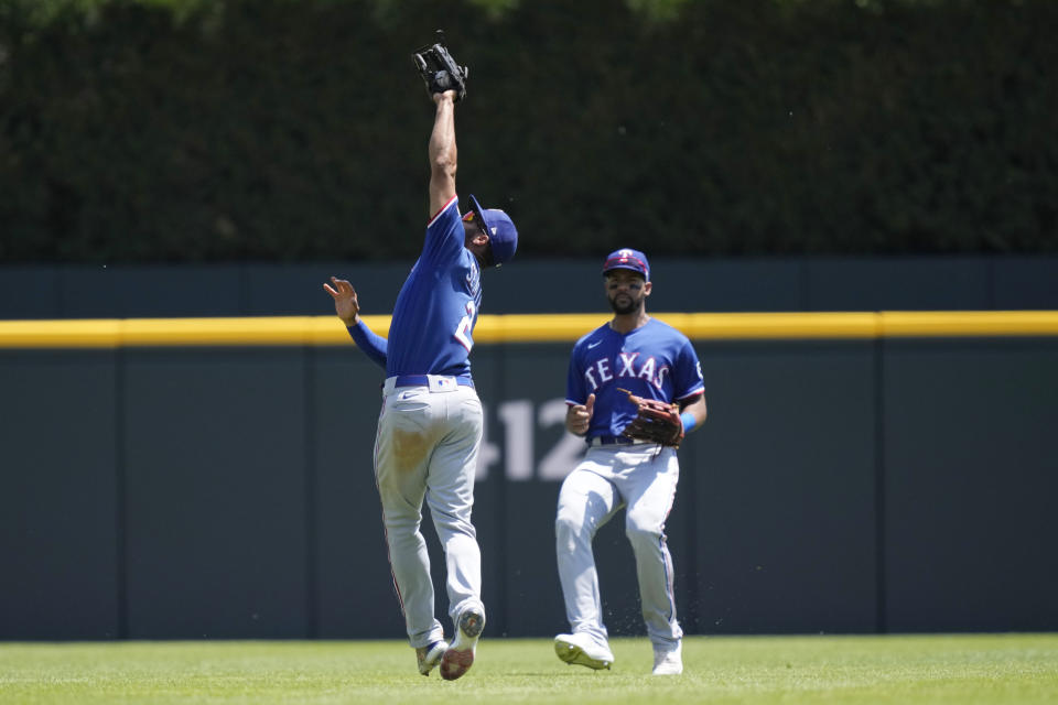 Texas Rangers second baseman Marcus Semien (2) catches the fly out hit by Detroit Tigers' Javier Baez during the fifth inning of a baseball game, Wednesday, May 31, 2023, in Detroit. (AP Photo/Carlos Osorio)