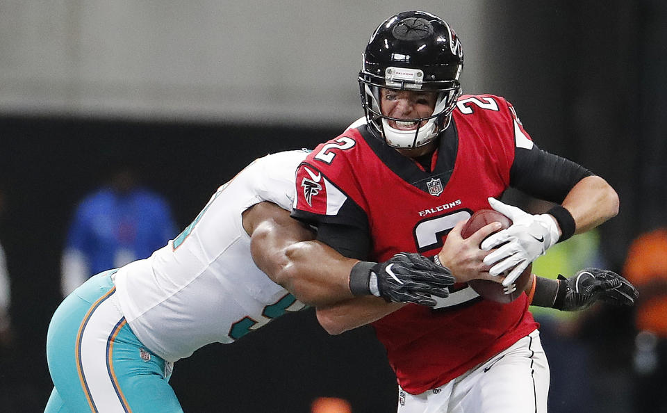 Miami Dolphins defensive end Cameron Wake sacks Atlanta Falcons quarterback Matt Ryan during Mimai's 20-17 road win. (AP)