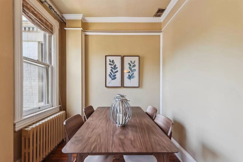 Dining table in room before renovation.