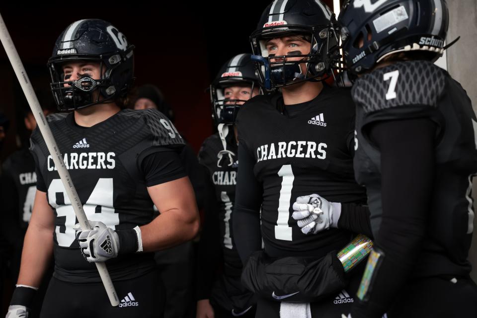 Corner Canyon quarterback Isaac Wilson and teammates prepare to face Farmington in a 6A football semifinal at Rice-Eccles Stadium in Salt Lake City on Thursday, Nov. 10, 2022. | Spenser Heaps, Deseret News