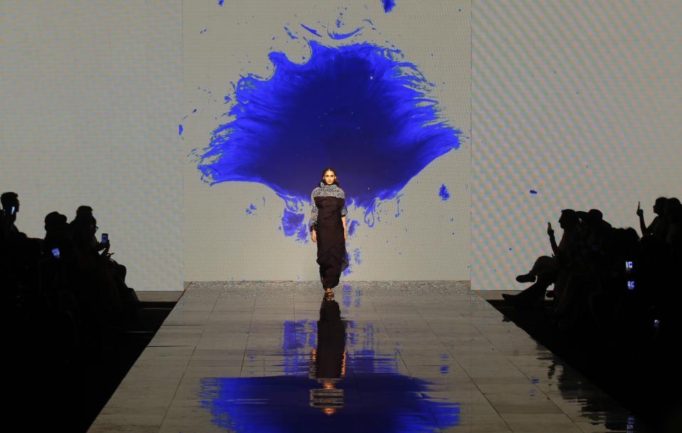 A model walks the ramp to showcase the creation of Medium during Lakme fashion week in Mumbai, India, Thursday, Feb. 13, 2020. (AP Photo/Rajanish Kakade)