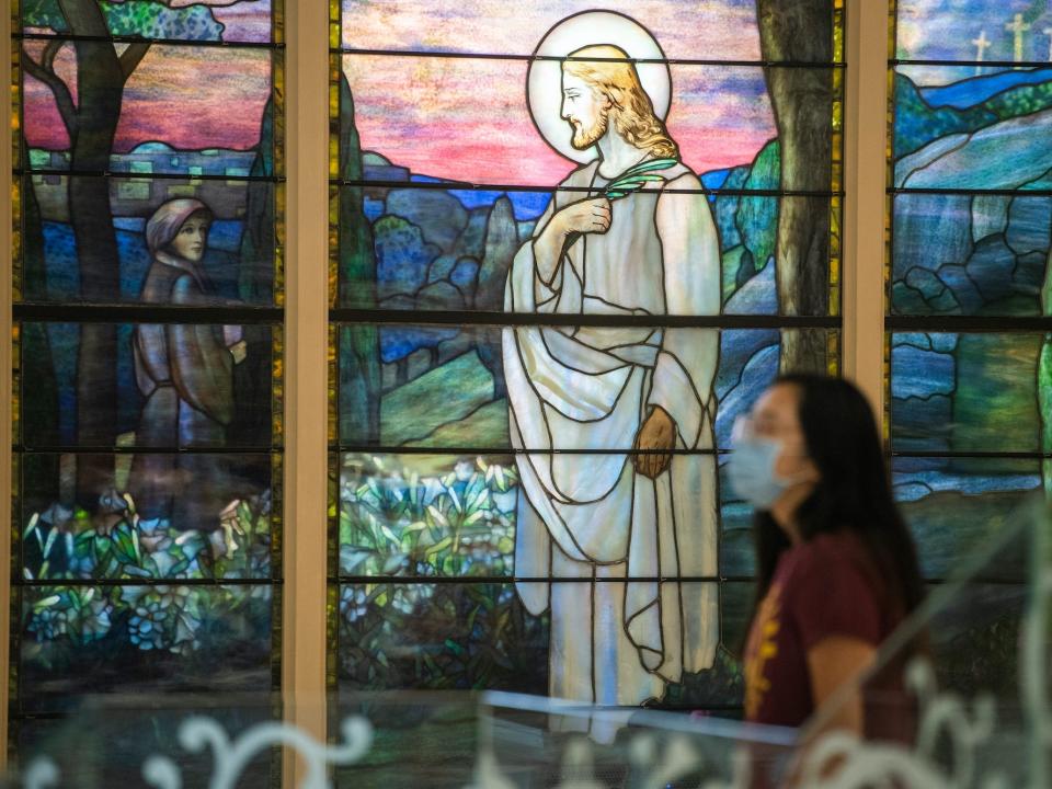 A woman walks through the Museum of the Bible